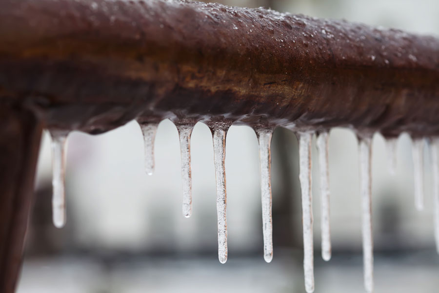Photo of a frozen pipe with icicles