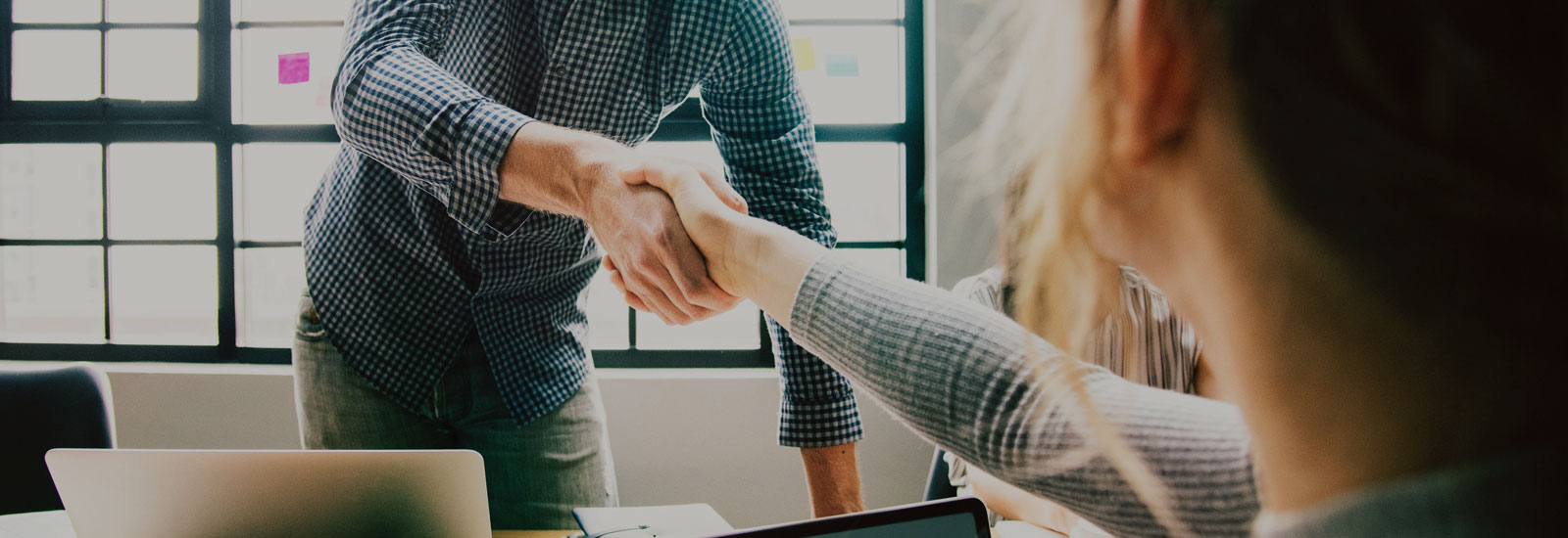 Photo of a man and woman shaking hands