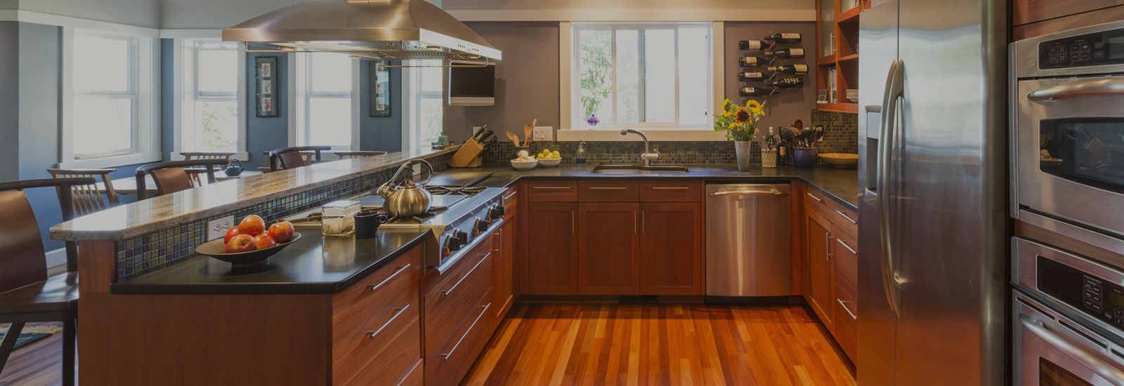 Photo of kitchen with appliances and dining area